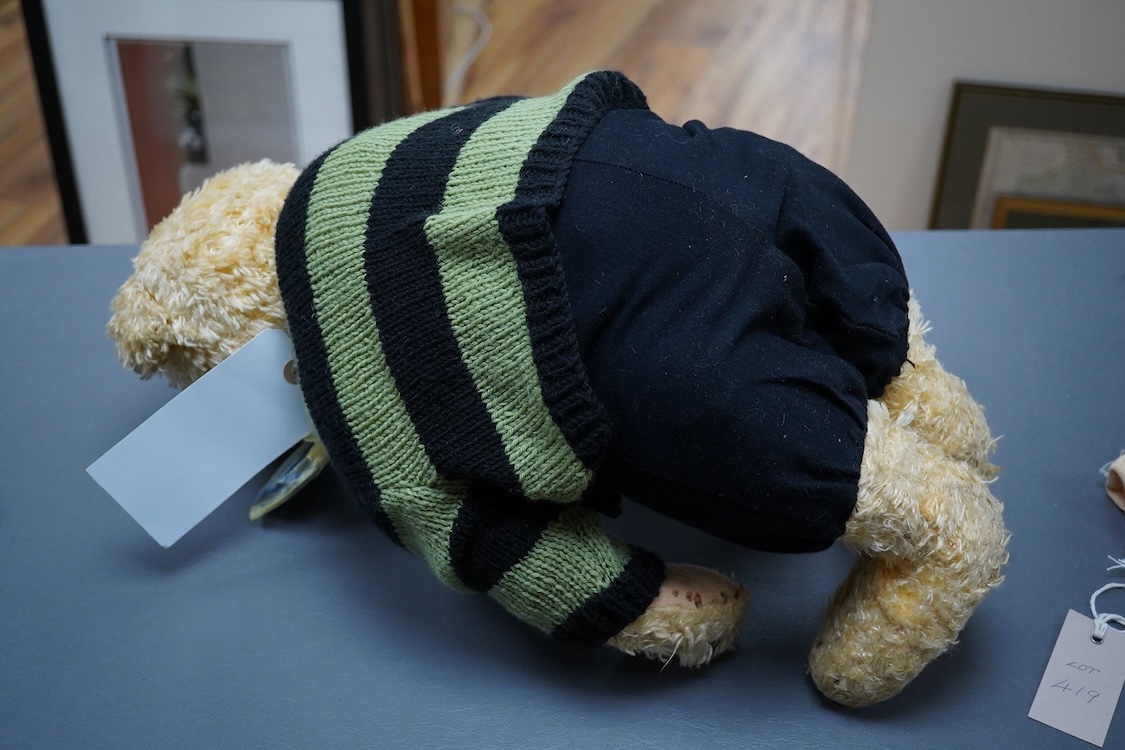 A Steiff artificial silk Teddy bear, (5650.2), jointed blonde body, stitched snout and glass eyes, button in ear, with related book and papers, bear 50cm